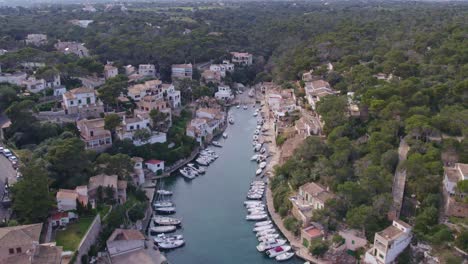 Wide-shot-of-touristic-Port-de-Cala-Figuera-at-Mallorca,-aerial