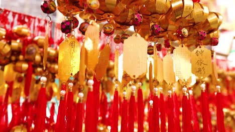 hanging golden bells with red tassels swaying