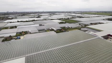 4K Aerial Drone Shot of Glass Greenhouse Flying Up
