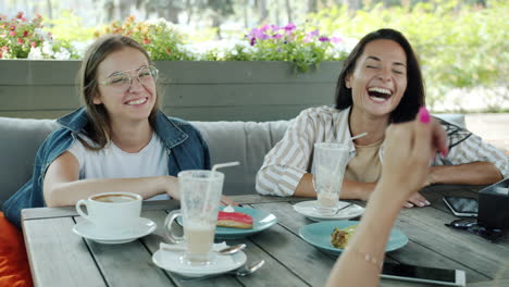 friends enjoying coffee in outdoor cafe