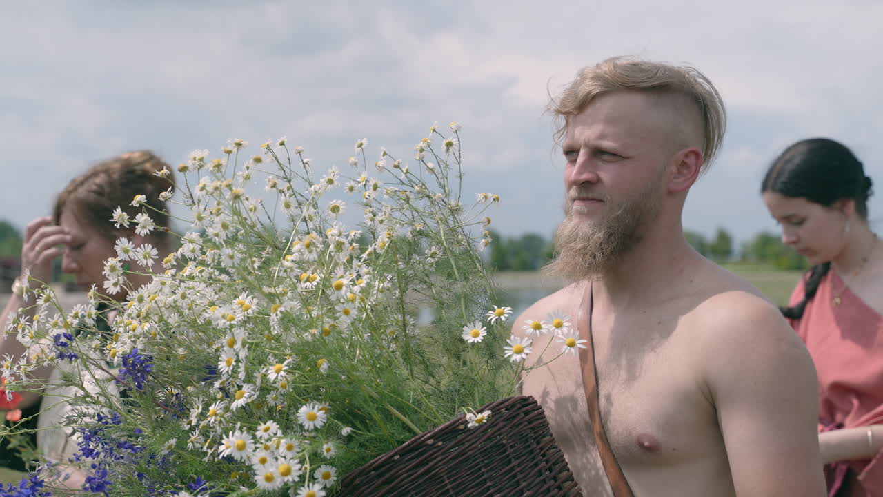 Man Carrying a Basket of Flowers