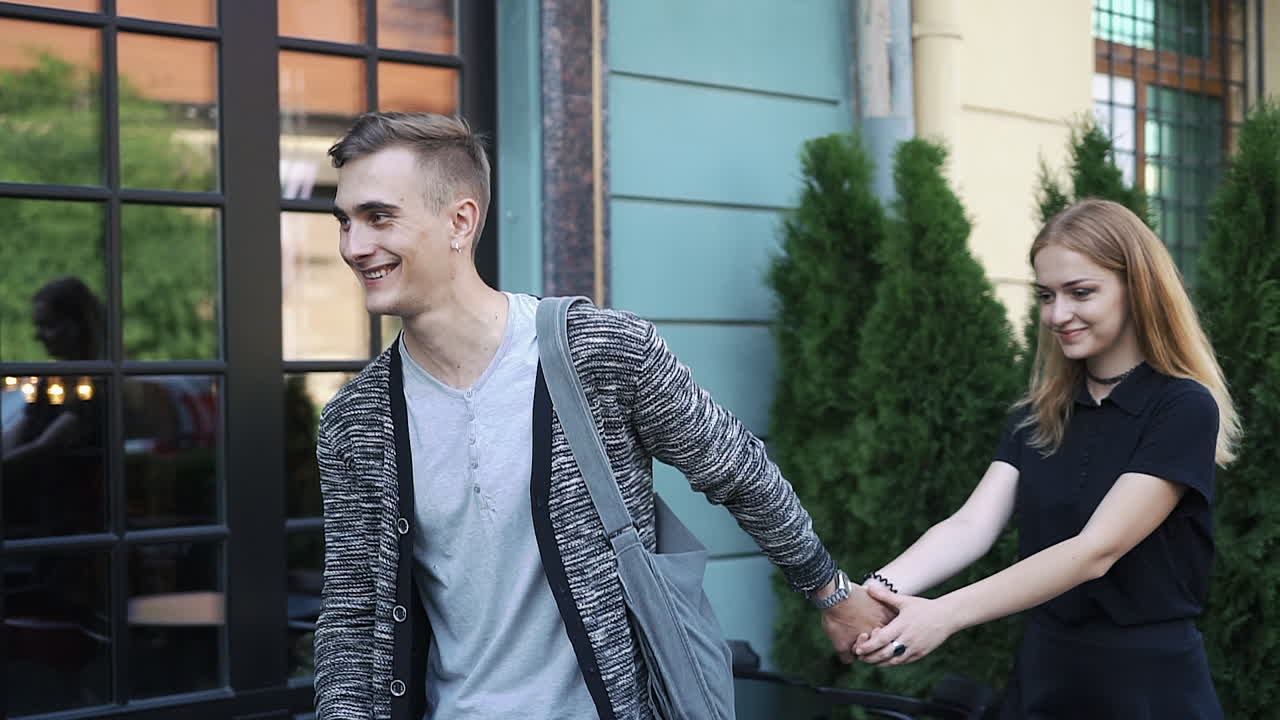 Couple Holding Hands on the Street