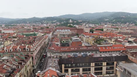 narrow streets and colorful rooftops of turin downtown, low altitude drone flying