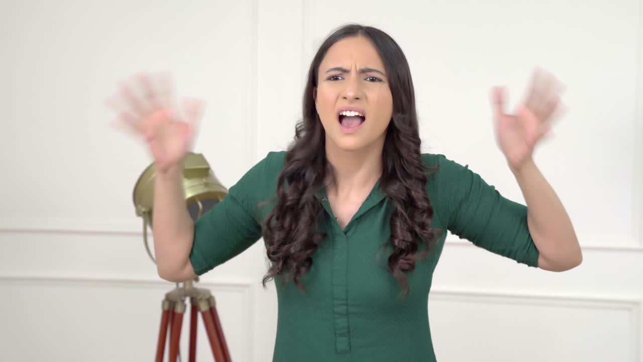 Angry Indian woman shouting and screaming