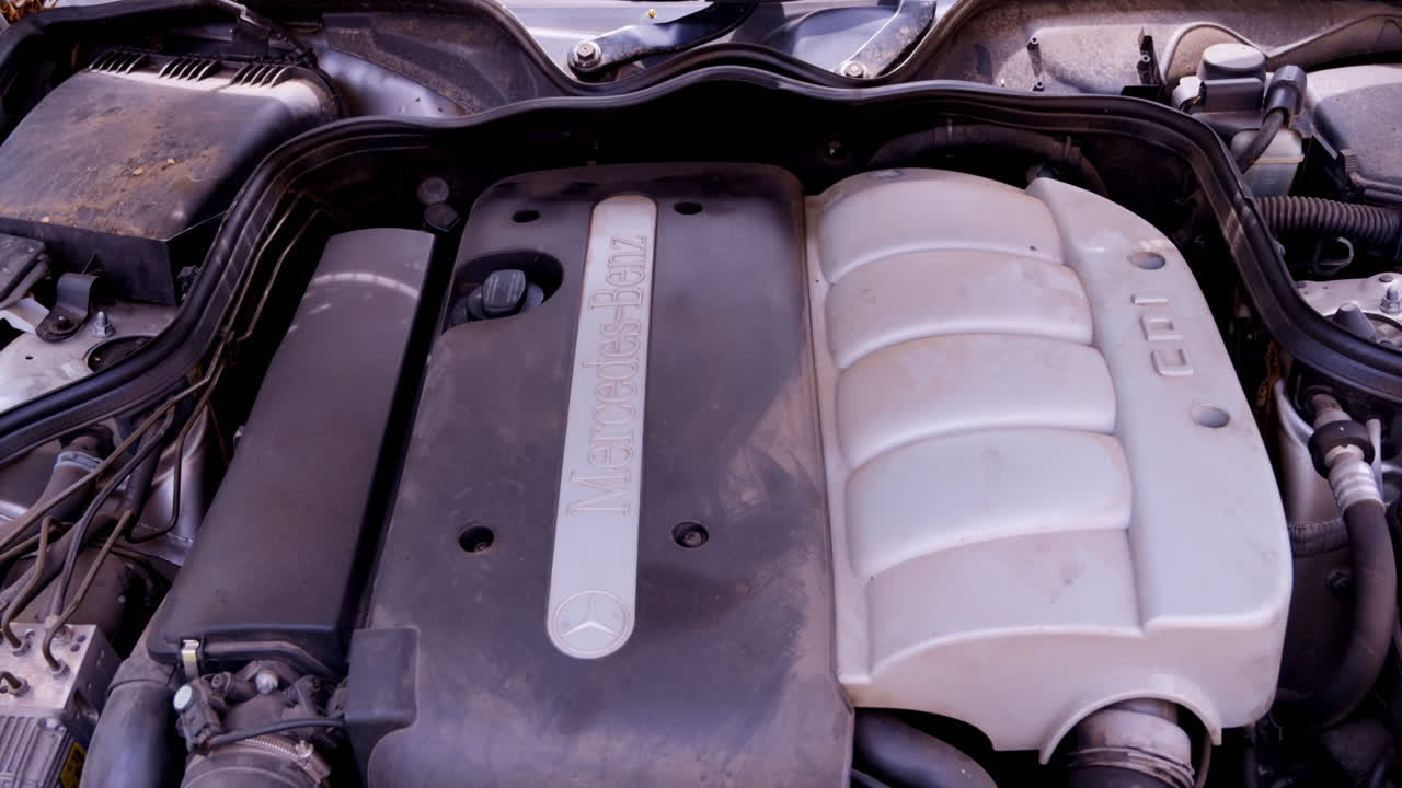 Chisinau, Moldova - April 21, 2022: The engine bay of a Mercedes-Benz E-Class car