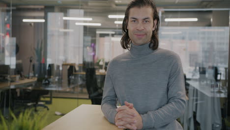 man smiling in modern office