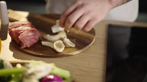 preparing meat and mushrooms