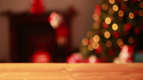 Empty-table-against-blinking-lights-on-christmas-tree