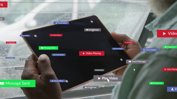 Man holding tablet by rainy window, his cursor clicking play causing badges piling fading for UX