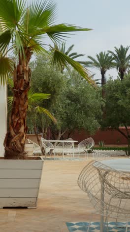 serene marrakesh garden with palms and seating, peaceful atmosphere