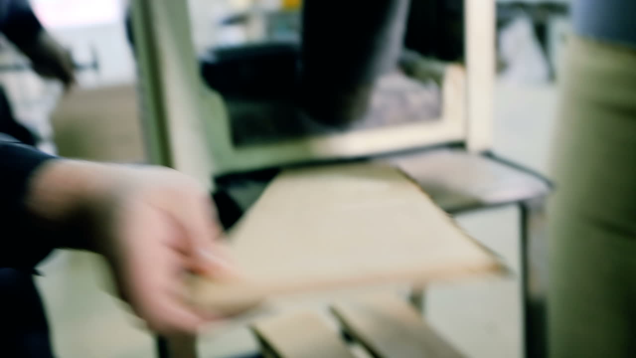 Carpenter Working In A Carpentry Workshop. Carpenter working with Industrial tool in wood factory