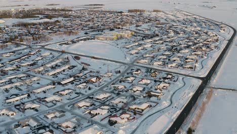 aerial panning shot of white snowy selfoss city during winter day in iceland