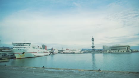 ships docked in a port on a calm day.