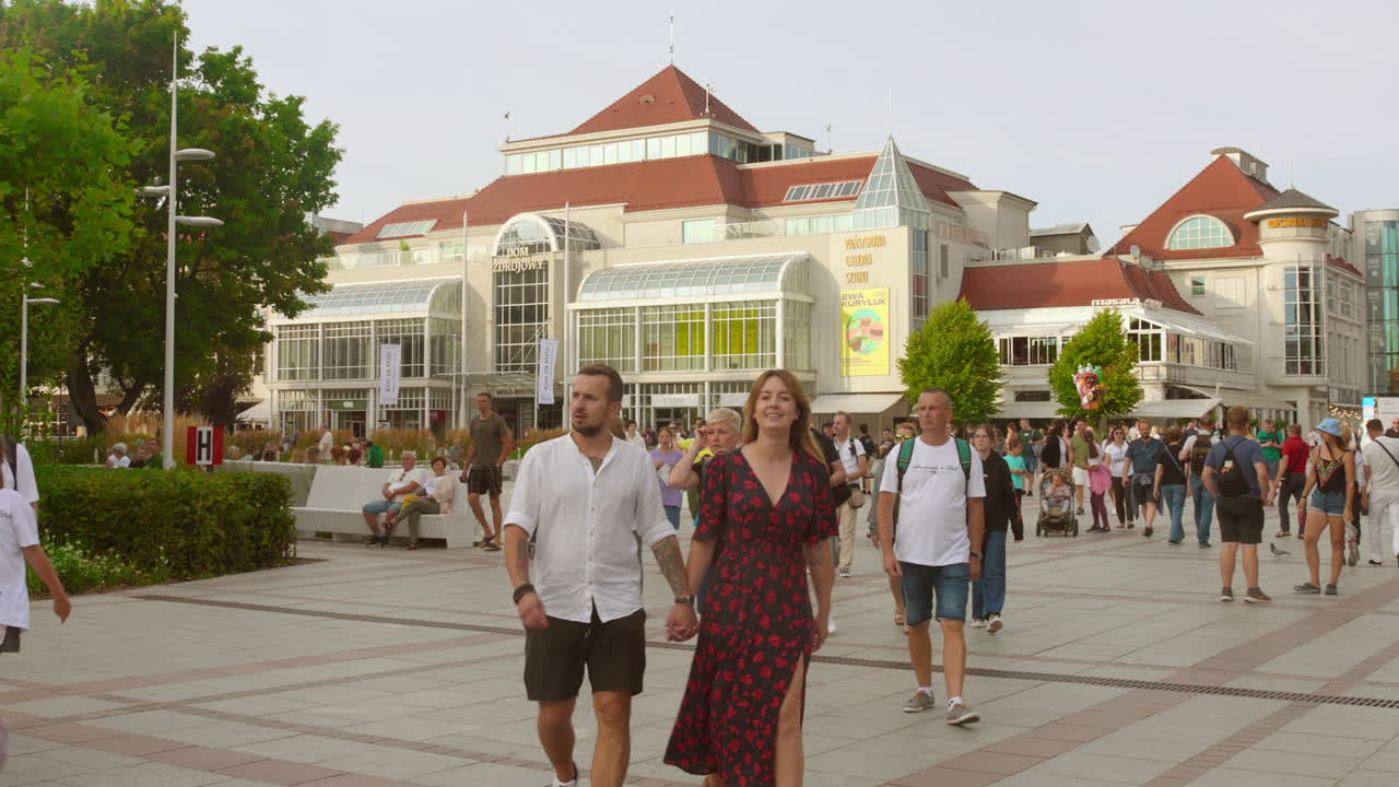 Visitors exploring Sopot town in Poland during daytime. Tourist destination.