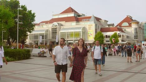 visitors exploring sopot town in poland during daytime. tourist destination.