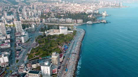 Aerial-orbiting-view-of-Peru-Avenue-and-ViÃ±a-del-Mar-Casino,-ViÃ±a-del-Mar-scenic-coastline,-Chile