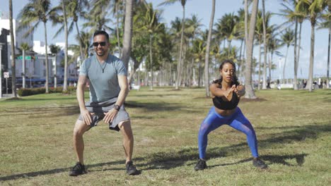 couple working out in park