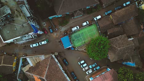 football pitch in the middle of a junction road - old goa - panjim, south india