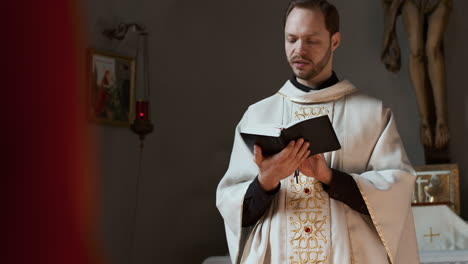 caucasian man saying mass