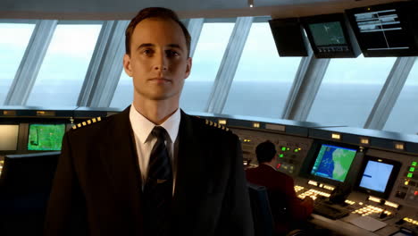 captain at the ship's bridge