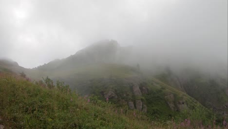 Mysterious-mountains-hidden-in-fog-view-from-Brienz-Rothorn-cog-train,-Switzerland