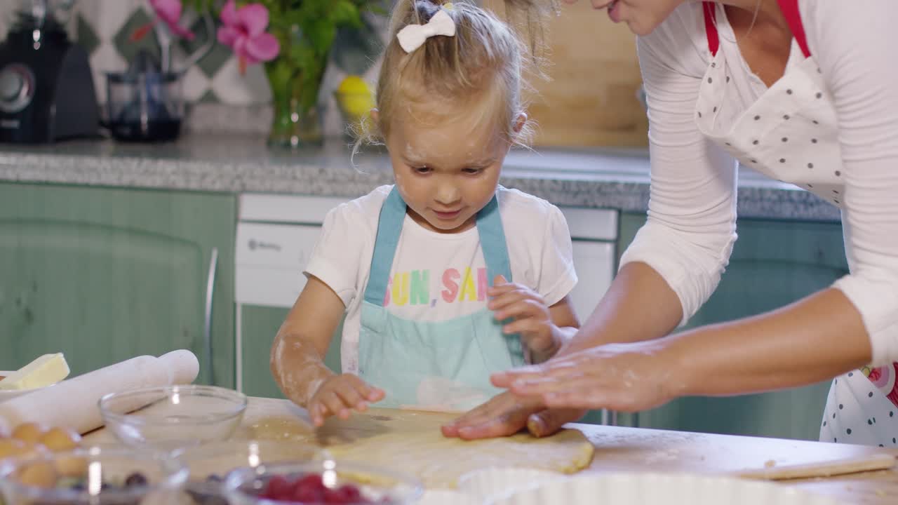 Mother and daughter working together in a kitchen