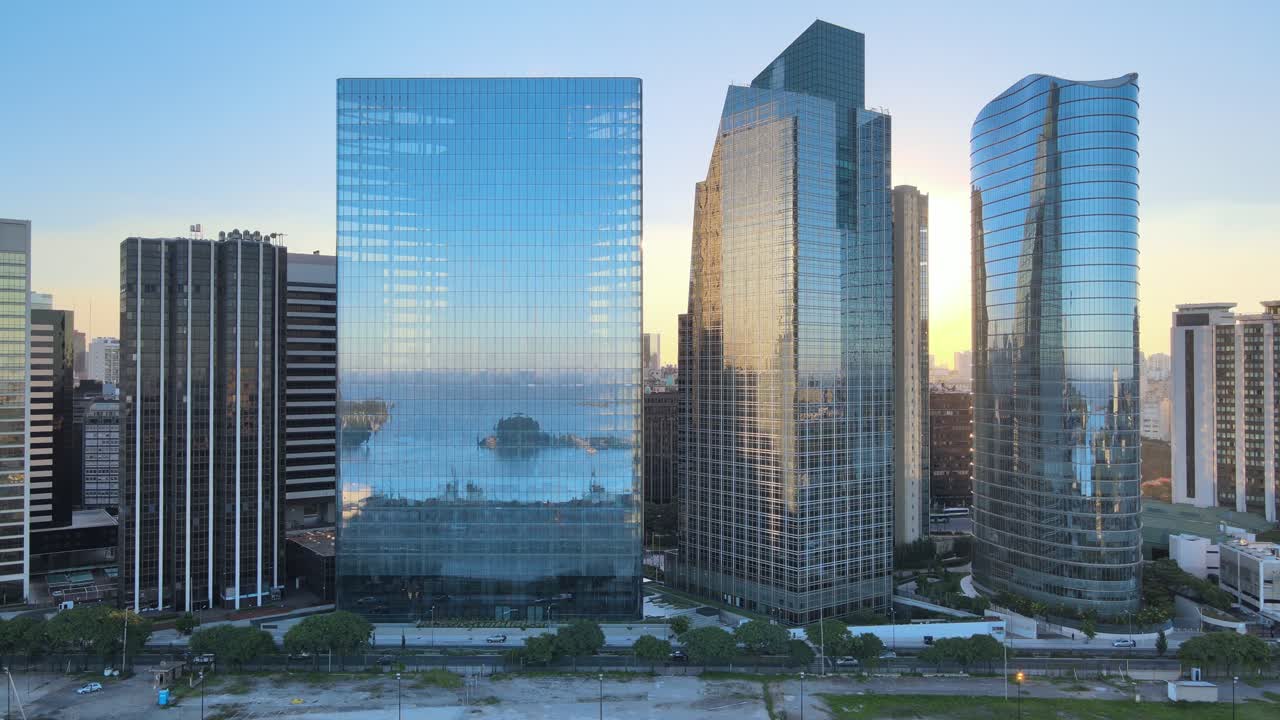 Aerial stationary shot capturing traffic moments in downtown Buenos Aires with high rise buildings cityscape in the background