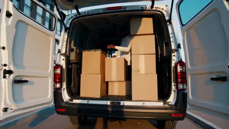 moving van loading boxes at commercial complex