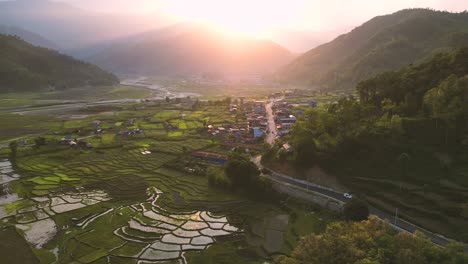 drone-shoot-of-a-rice-field-plantation-at-sunset-time-in-the-rural-area-of-Pokhara---Nepal