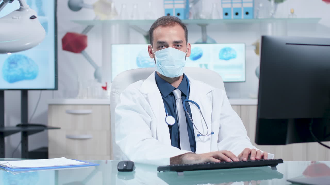 Doctor working at desk wearing face mask in laboratory