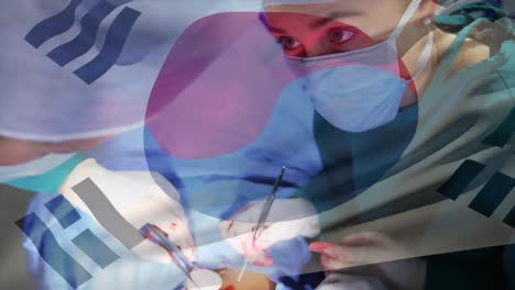 Animation-of-flag-of-south-korea-waving-over-surgeons-in-operating-theatre