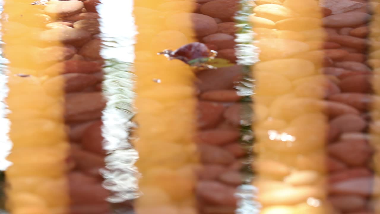 Patterns of architecture orange pillars reflected in water