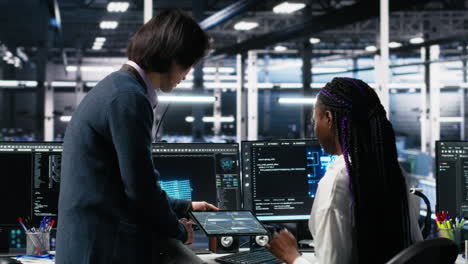 multiethnic team in diverse data center coding with generative ai assistance