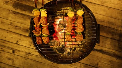 skewers cooking evenly on a round grill