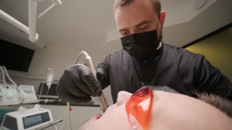 dentist performing dental procedure on patient