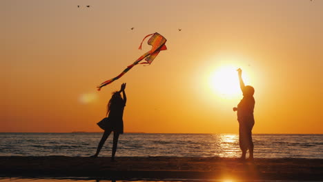 an elderly woman stands next to her granddaughter at sunset active seniors