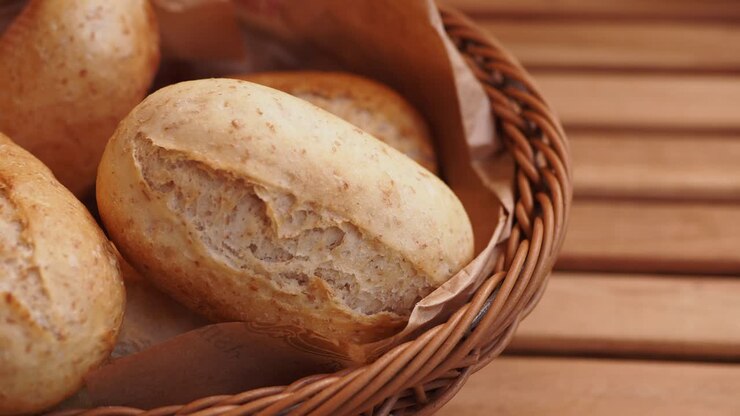 Freshly baked rolls in a wicker basket