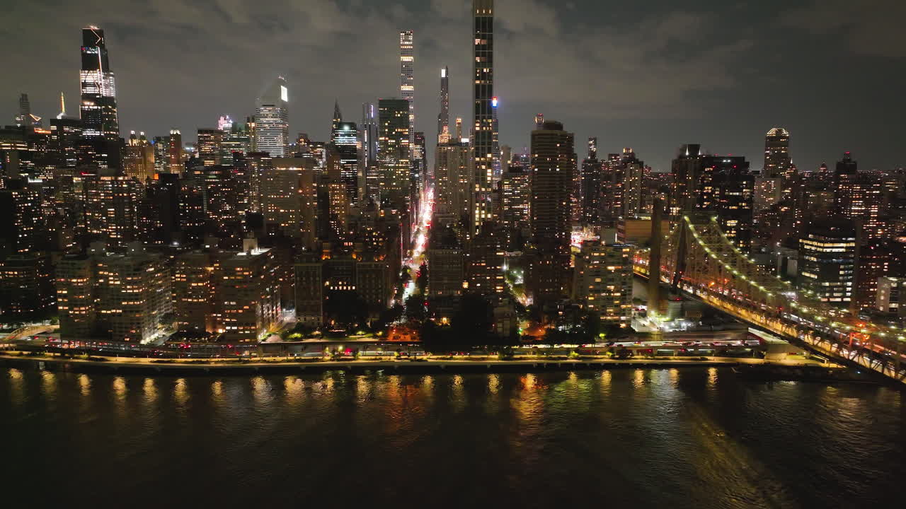 Night View Of Manhattan With Ed Koch Queensboro Bridge In New York - Aerial Drone Shot