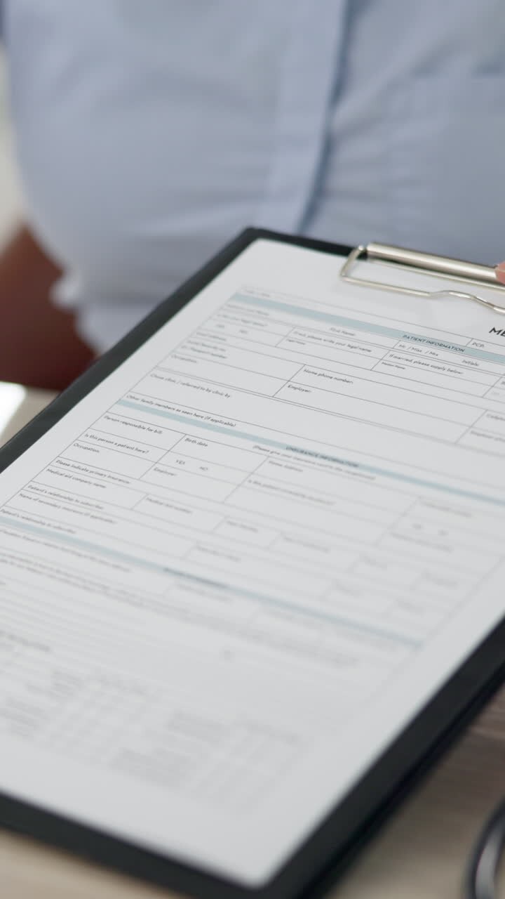 A person fills out a medical form