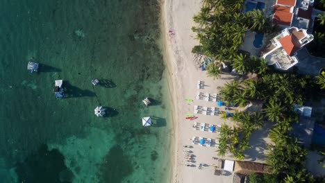 aerial view of cozumel beach with inflatable games