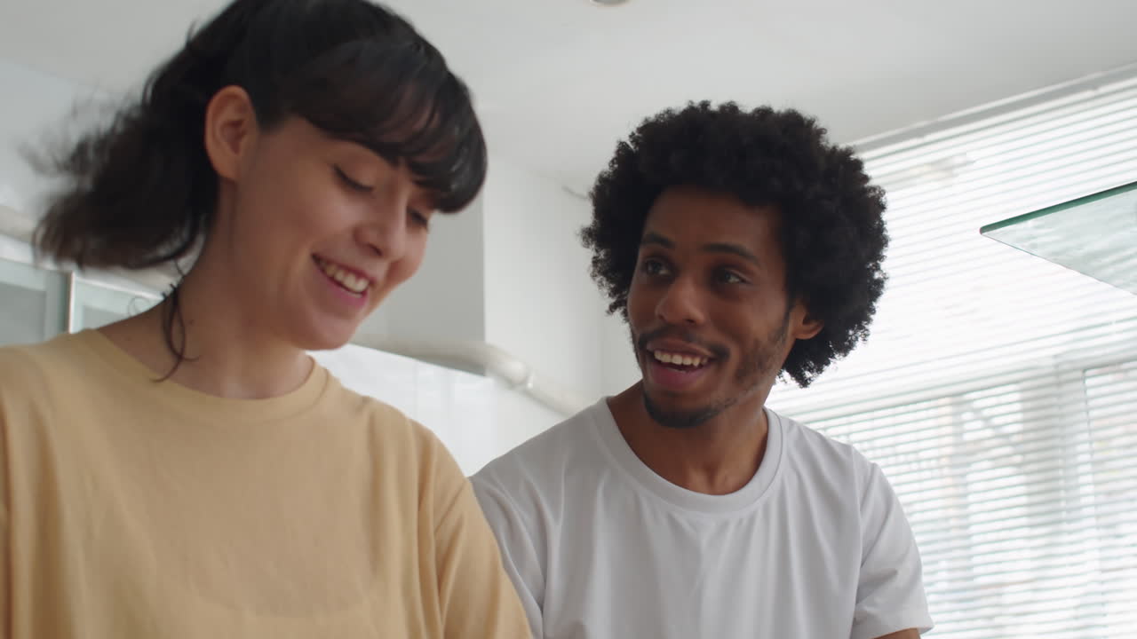 Married Couple Cooking Breakfast Together at Home