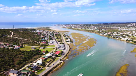 motorboats and pleasure crafts on goukou estuarine river in scenic still bay