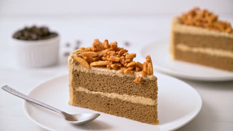 homemade-coffee-almonds-cake-on-white-plate