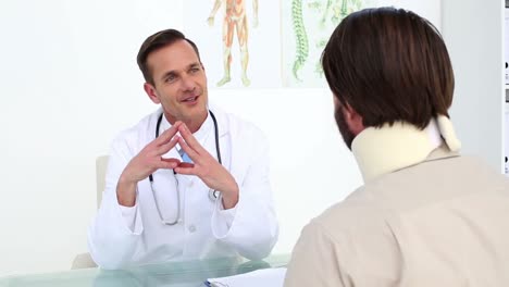 Doctor-talking-with-his-patient-in-a-neck-brace