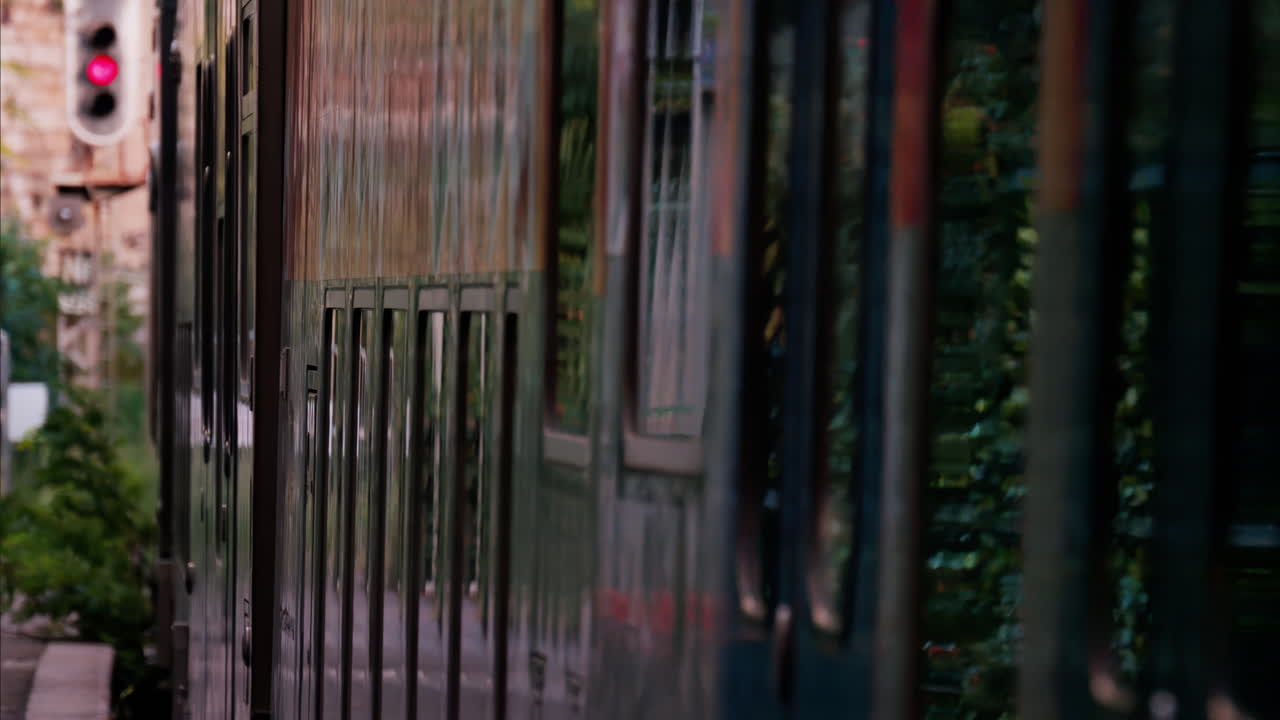 Close up of a train moving on the rails near a station in France