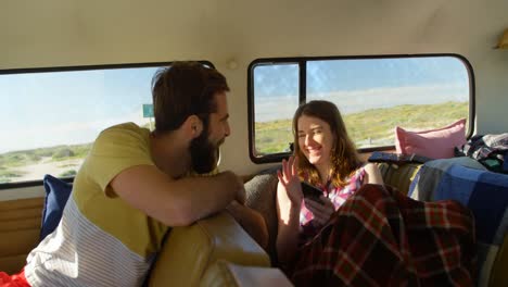 Happy-couple-interacting-with-each-other-in-the-van-4k