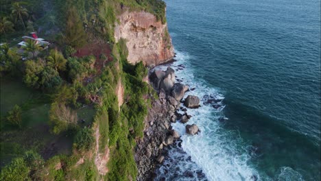 Island-Sea-Cliffs-of-Yogyakarta-in-Bali,-Indonesia-at-Sunset---Aerial