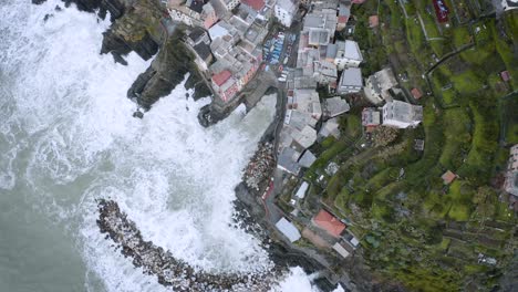 aerial view of riomaggiore, cinque terre, during a sea storm