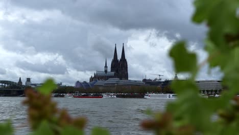 coal ship on rhine in front of cologne cathedral, germany, 4k