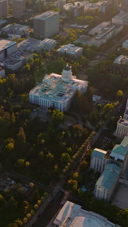 beautiful city panorama with modern buildings and lots of greenery. lovely urban scenery from aerial view. vertical video